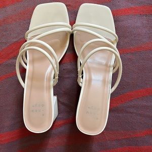 A new day white Blakely Mule heels in size 7.5